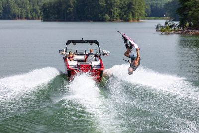  wakeboarder doing a flip behind the Heyday H20, shot on Lake Lanier near Atlanta Georgia