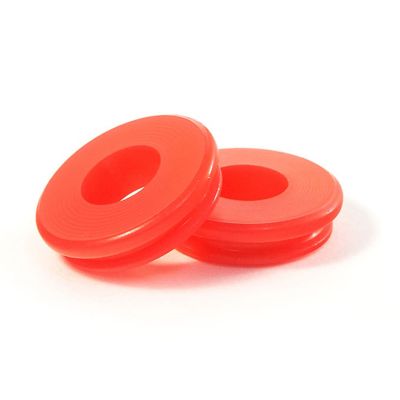 Red poly gladhand seal by Tramec Sloan, showcasing its vibrant color and smooth, durable design.