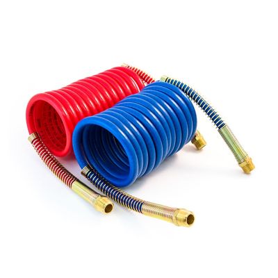 Red and blue coiled air hoses by Tramec Sloan with brass fittings, ideal for efficient and organized installation.
