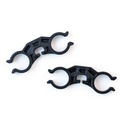 Black Tramec Sloan air hose separator clips on a white background, designed for efficient hose management.