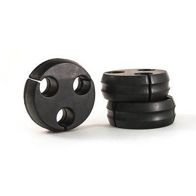 Black puck-shaped hose separators with multiple openings for hose alignment and organization.