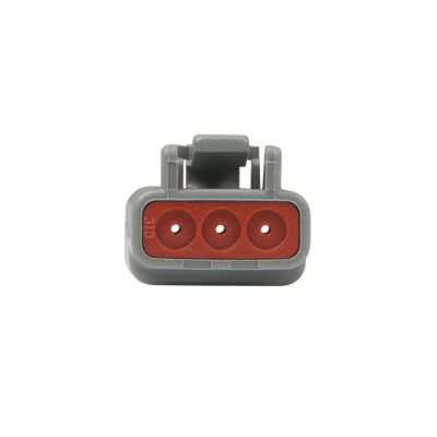 Gray and red DEUTSCH DTM Series 3-Way Plug connector, showcasing three circular openings for wiring applications.