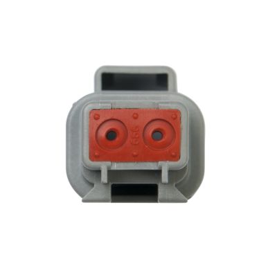 Close-up of Deutsch DT Series 2-way receptacle connector, showing red and gray design features.