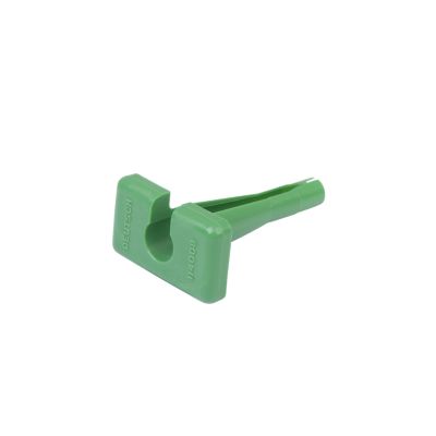 Green Deutsch 114008 contact removal tool with ergonomic handle design on a white background.