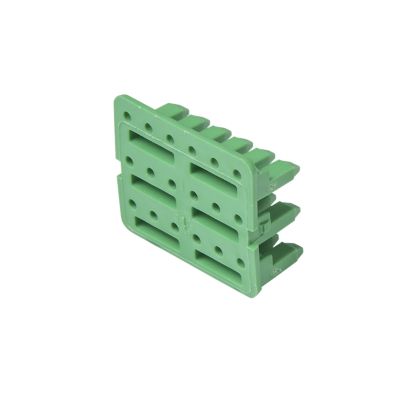 Green Deutsch WV-18P, DTV 18-way receptacle wedge with multiple slots and holes, angled view on white background.