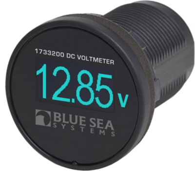 Blue Sea Systems mini OLED DC voltmeter displaying voltage on a sleek black device.