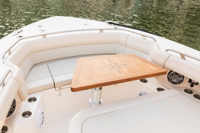Cushioned seating with boat table on Boston Whaler 
