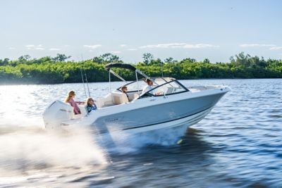 Family of 4 on Boston Whaler 210 Vantage Dual Console Boat, Starboard View, Boat Underway