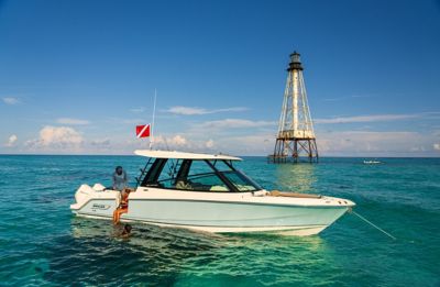 Boston Whaler 330 Vantage Anchored with Two Passengers and One Swimmer