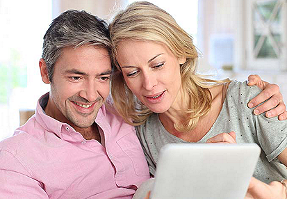 Couple looking at a tablet