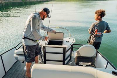 Father and Son Fishing Off the Back of a Lowe Pontoon Boat, Looking in Livewell