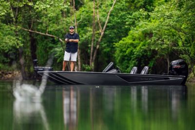 Fisherman Standing on Lowe Stinger 195 Aluminum Bass Boat, Port View, Boat Anchored