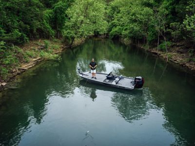 Fisherman Driving Lowe Stinger 198 Aluminum Bass Boat on Lake, Stern View