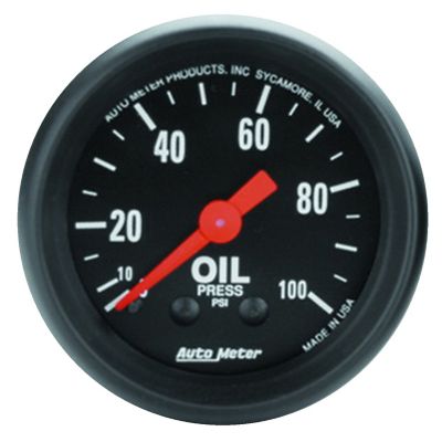 Black pressure gauge with white numbers, red needle, and "Oil Press PSI" label. Made in USA by Auto Meter.