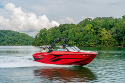 hree People on Heyday Wake Boat, Starboard View, Boat Underway