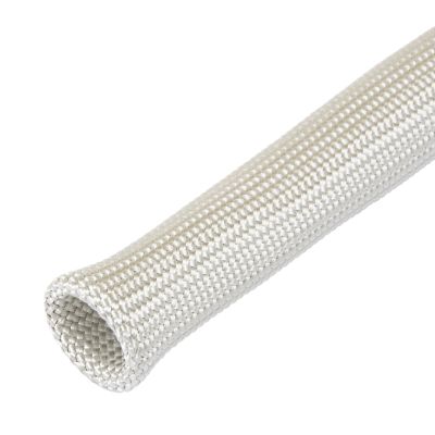 Natural Insultherm spark plug boot insulator in close-up, highlighting woven texture and protective design.