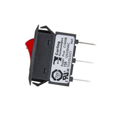 Red illuminated Carling switch circuit breaker with visible electrical specifications and connection pins.