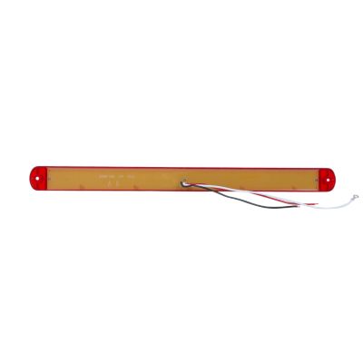 Thin LED stop, tail, turn light with 28 diodes and red lens, featuring rear view with wiring connectors.
