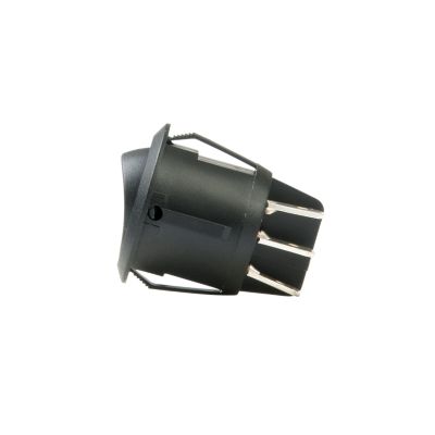 Round black DPDT non-illuminated rocker switch with multiple metal prongs, side view against white background.