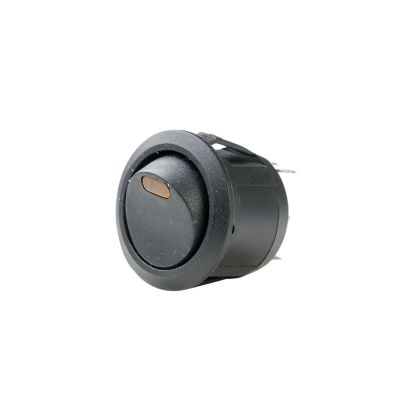 Black SPST on-off round rocker switch with amber LED illumination, AC rated, isolated on a white background.
