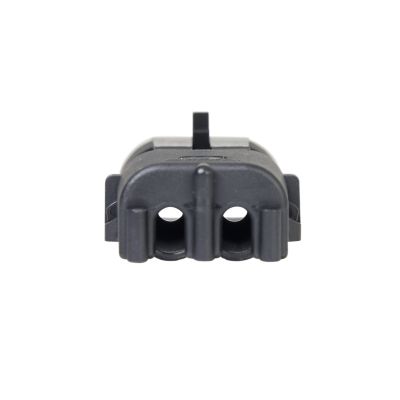 Close-up of a black Weather Pack Male connector, highlighting its two circular ports and robust housing design.