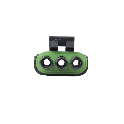 Connector with three circular ports, green and black housing, featuring a weather-resistant design.