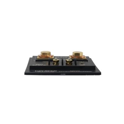 View from the side of a thin black solid state battery isolator switch with multiple connection points and mounting holes, 200 amp
