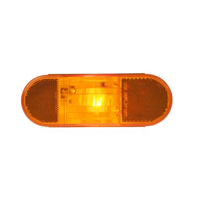Amber side marker and turn signal lamp with reflective accents, illuminating in vibrant orange.