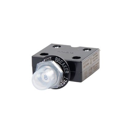 Push button circuit breaker with protective boot, featuring a compact design suitable for electrical safety applications.