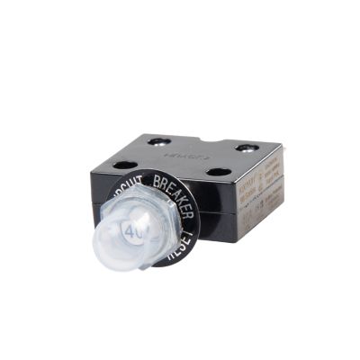 Black push button circuit breaker with metal terminals and transparent boot, from Carling Technologies CLB Series.