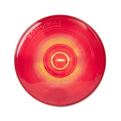 Red round stop, tail, turn lamp with concentric ridges, designed for vehicle signaling and enhanced visibility.