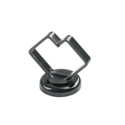 Magnetic black cable holder with a sturdy base for securing cable bundles efficiently.