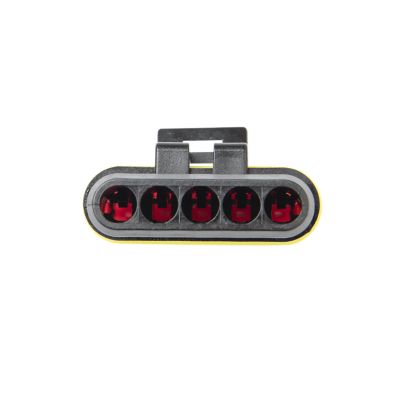 Five-way TE AMP Superseal Series plug housing with black exterior and visible red connector chambers.