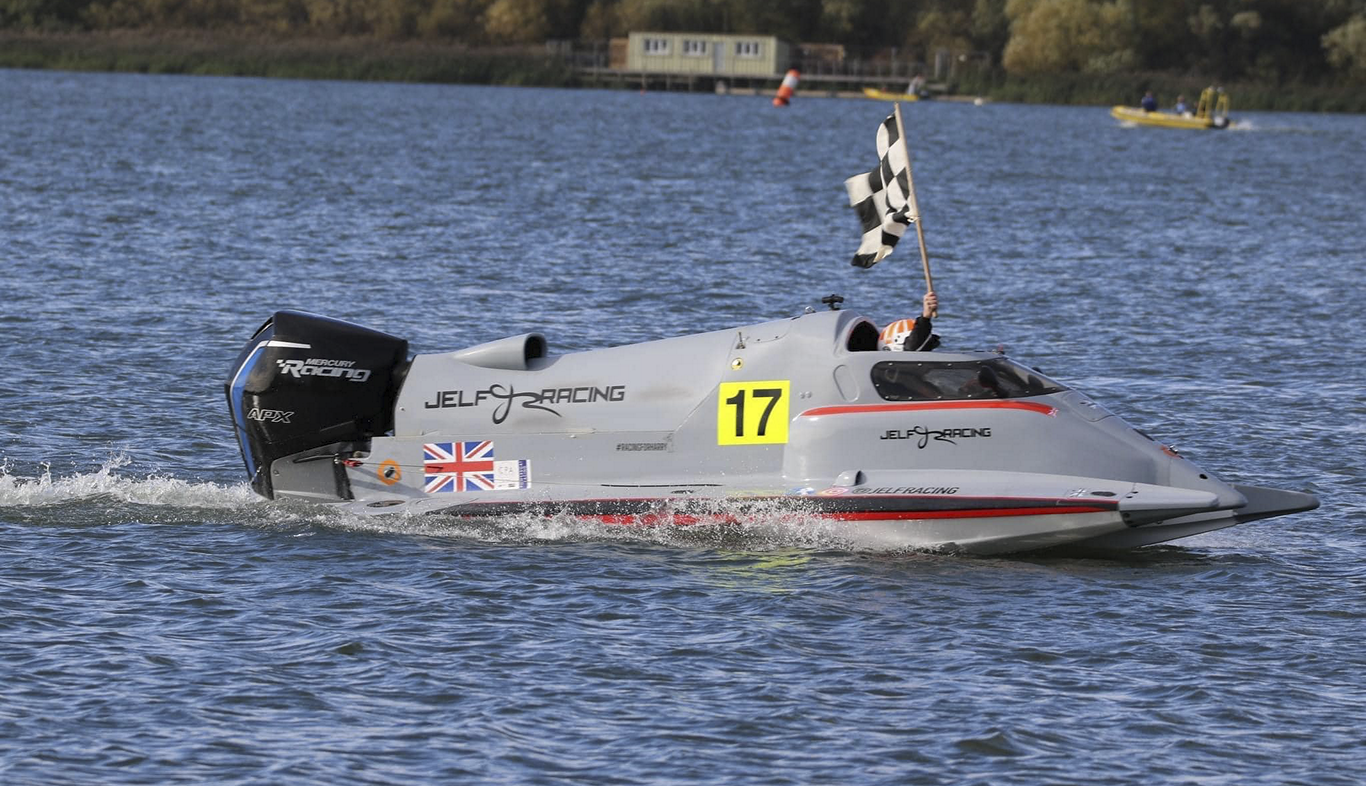 Racing Boat With Finish Line Flag
