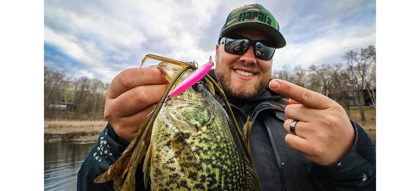 Professional fishing guide, Brad Hawthorne, holding a crappie fish