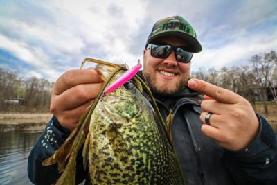Professional fishing guide, Brad Hawthorne, holding a crappie fish