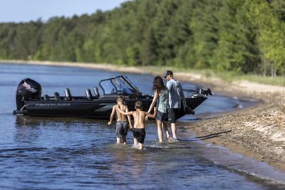 Family of Four Walking Towards Anchored Crestliner Sportfish Boat