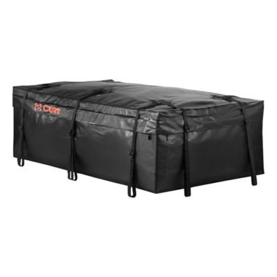 Black weather-resistant vinyl cargo bag with secure straps, designed for roof rack baskets, featuring the CURT logo.
