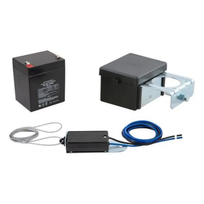Trailer breakaway switch kit with battery, featuring black casing, wiring, and metal components for safety and control.