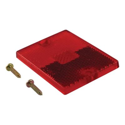 Red replacement side trailer light lens and screws, CURT 53515, with textured surface.