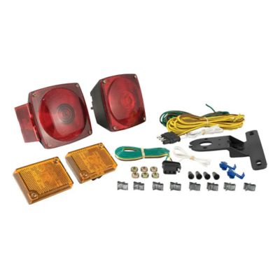 Replacement trailer light kit with red and amber lamps, wiring, connectors, and mounting bracket displayed on a white background.