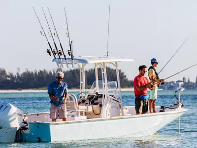 family fishing off a boat