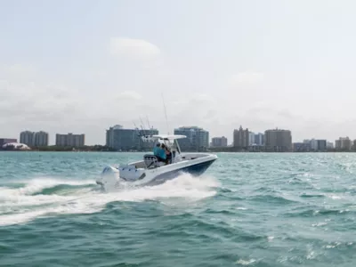 Couple Riding in Bayliner Trophy Center Console Fishing Boat, Starboard-Stern View, Boat Underway