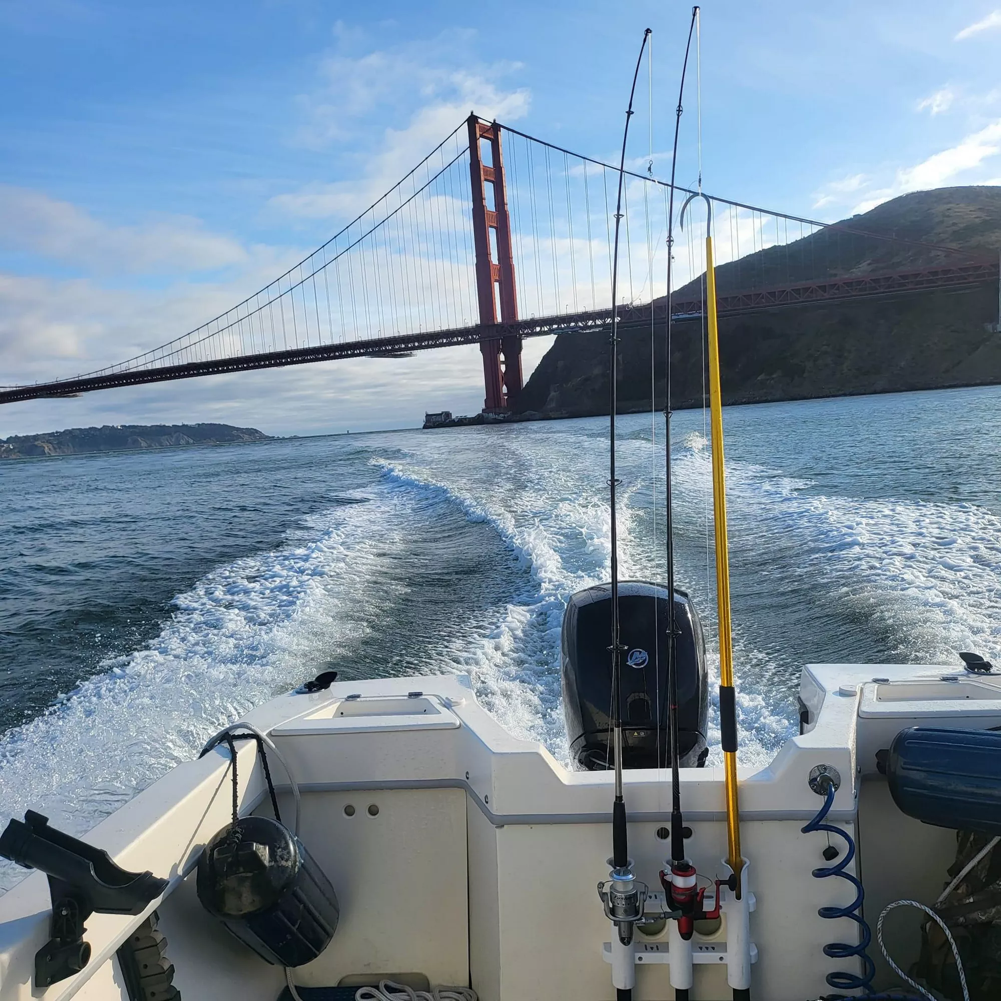 view of the golden gate bridge from the stern of a boat