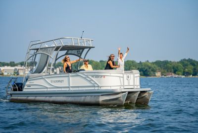 Family On Pontoon Party On Lake