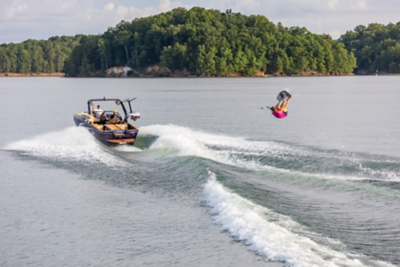 Wakeboarder Behind Heyday Wake Boat, Starboard View, Boat Underway