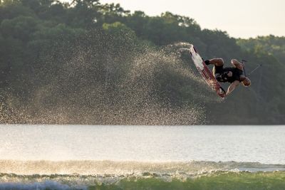 wakeboarder doing a trick in the air
