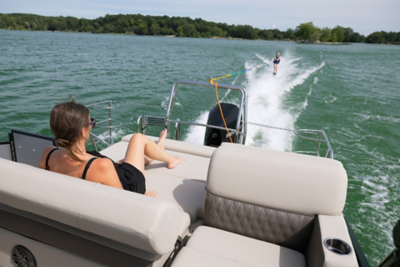 Women lounging on a Harris pontoon boat. 
