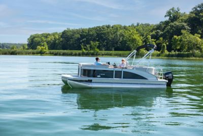 Harris Breeze 210 Pontoon Anchored on Tree-Lined Lake with Two Passengers Onboar