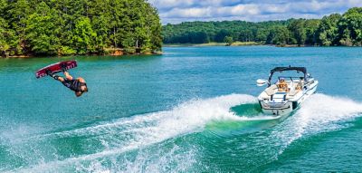 Wakeboarder up in the air behind a Heyday Wake boat